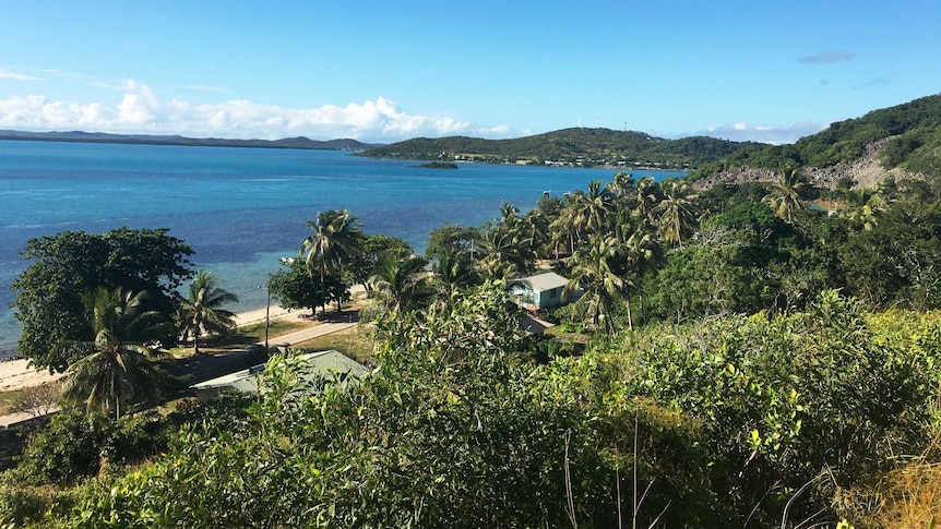 The view from St Joseph's Church reveals palm-fringed beaches, turquoise water, reefs and a glimpse of nearby Thursday Island