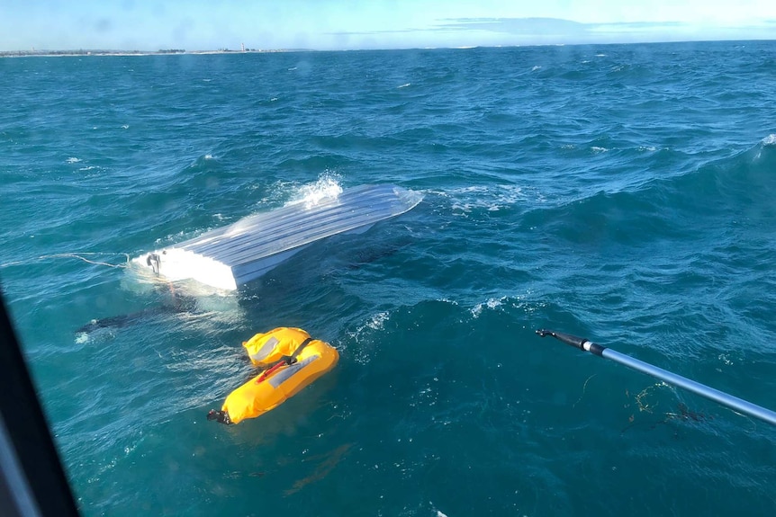 capsized boat in water