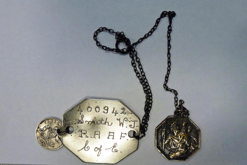 ID tag and charms belonging to RAAF WWII Spitfire pilot Sergeant WJ Smith, who was killed in in France on May 9, 1942.