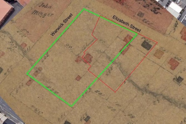 A faded old map showing two overlapping building outlines