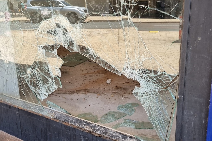 Smashed window with some glass still intact. 