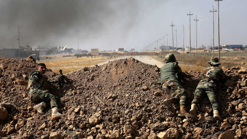 Kurdish security forces take up a position ahead of fight to seize Mosul from Islamic State