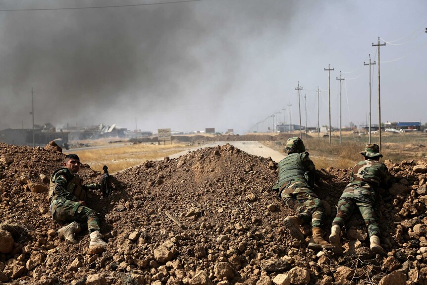 Kurdish security forces take up a position ahead of fight to seize Mosul from Islamic State