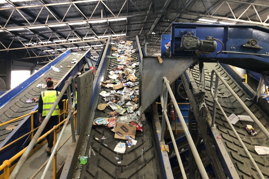 A conveyer belt of rubbish. 