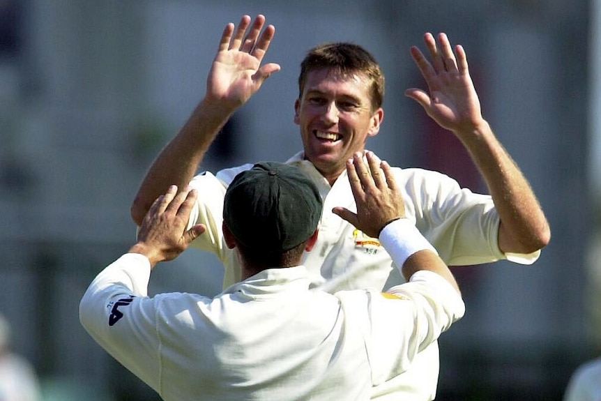 Glenn McGrath and Ricky Ponting celebrate the wicket of England captain Nasser Hussain