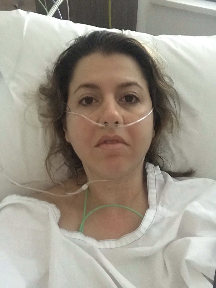Stephanie Dalzell takes a selfie in hospital post op.