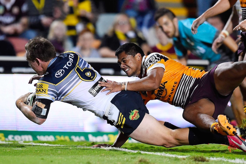 Michael Morgan of the Cowboys scores a try