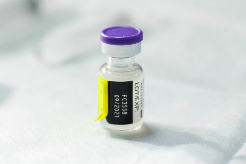 Vial of Pfizer vaccine at COVID-19 vaccination clinic.