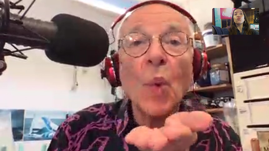 triple j presenter lucy smith and dr. karl blowing kisses to each other over a skype chat