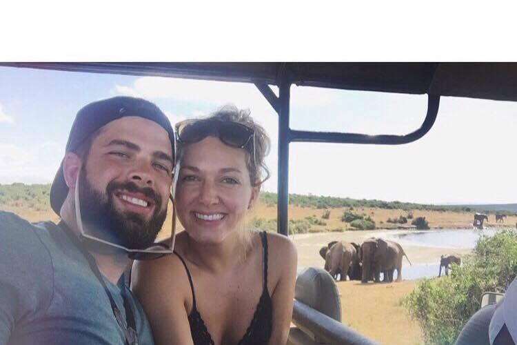 Monique Schierz-Crusius and Stuart Binfield with elephants in the background.