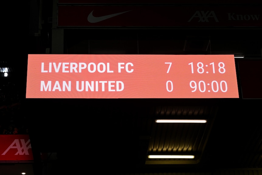 A red scoreboard shows Liverpool beating Manchester United 7-0.