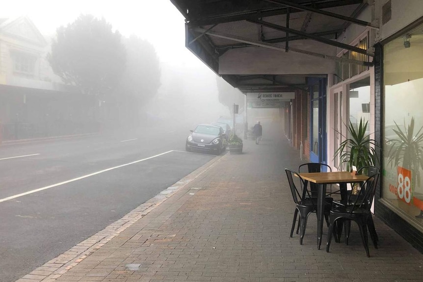 A street covered in mist
