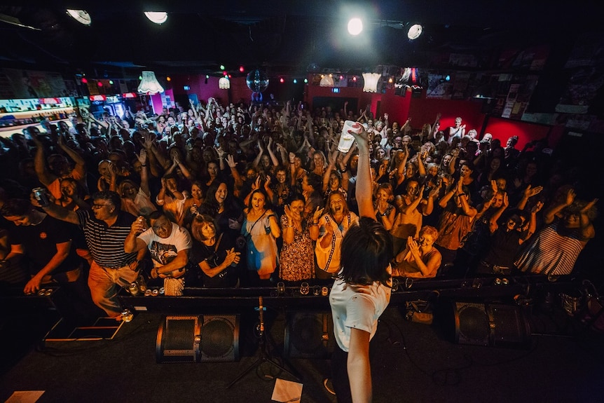 Looking at a crowd in a bar from the stage.