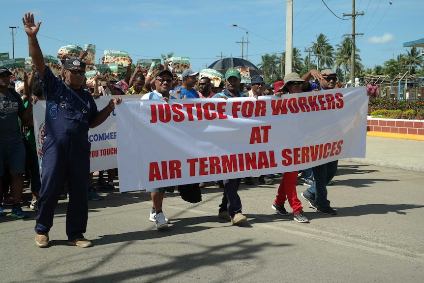 Demonstrators in Fiji's tourist town Nadi protest in support of airport workers