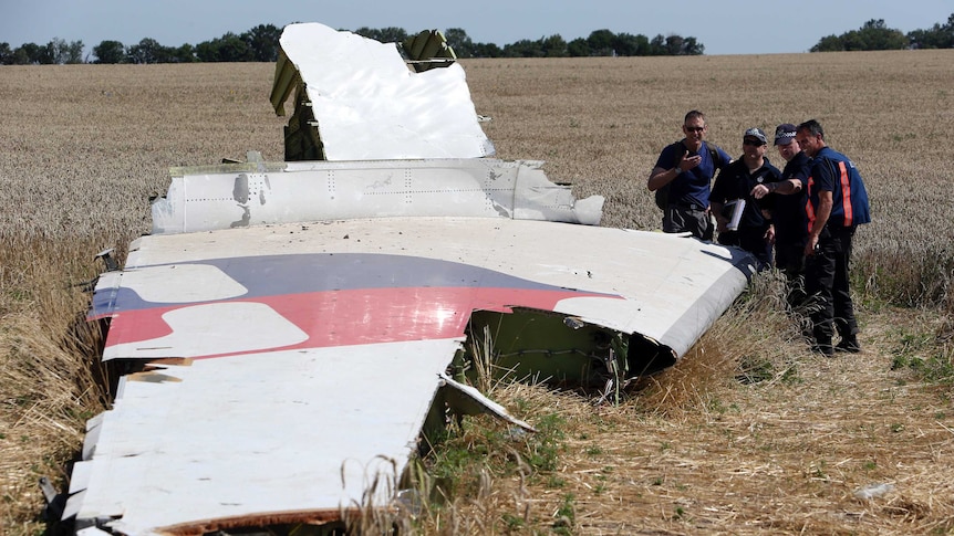 International experts inspect wreckage at MH17 crash site