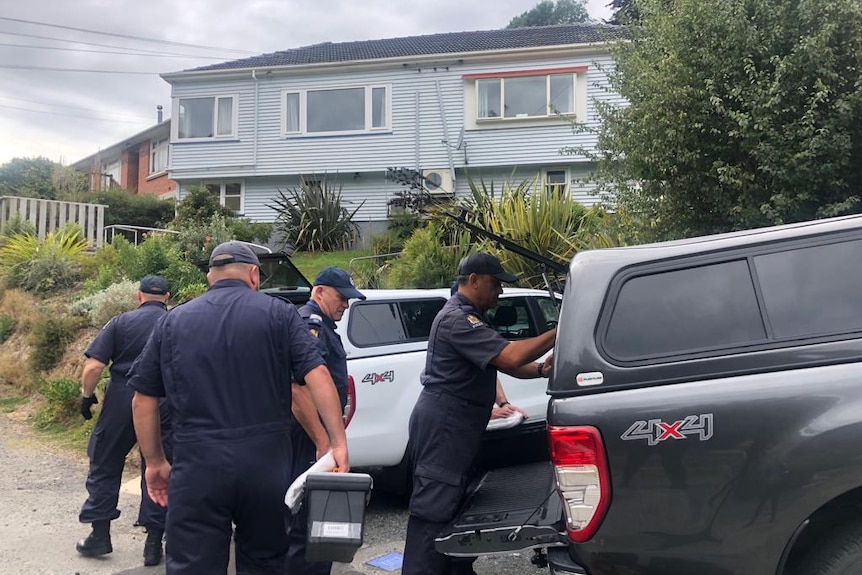 Police outside a home in Dunedin, New Zealand.
