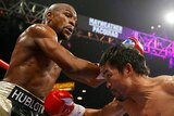Floyd Mayweather Jr and Manny Pacquiao exchange punches in their welterweight bout in Las Vegas.