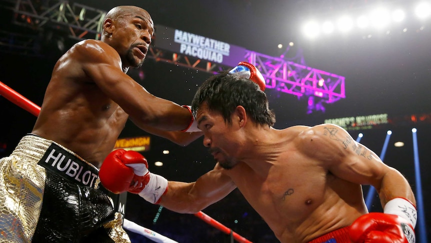 Floyd Mayweather Jr and Manny Pacquiao exchange punches in their welterweight bout in Las Vegas.