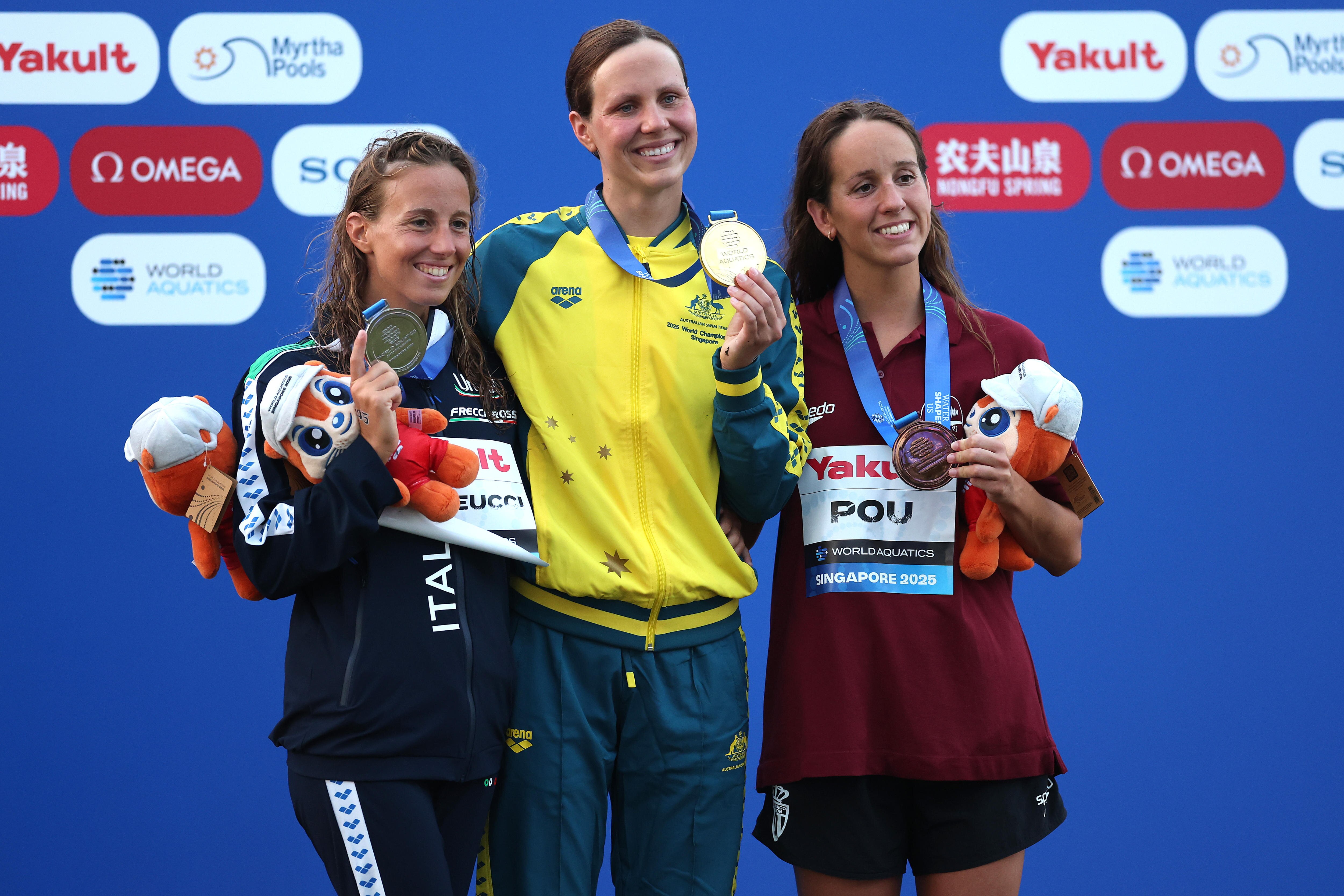 Moesha Johnson on podium with fellow medallist at World Aquatics Championships.