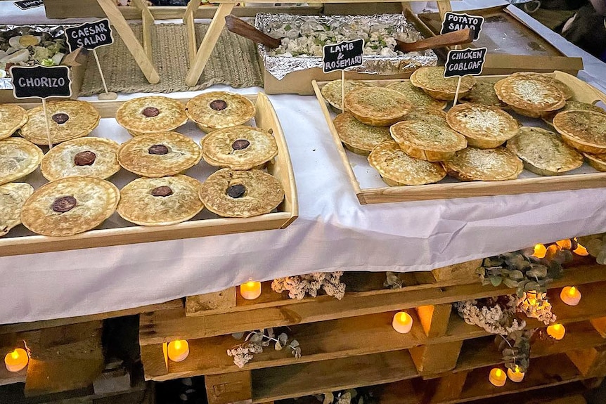 different varieties of meat pies served on a table at a wedding