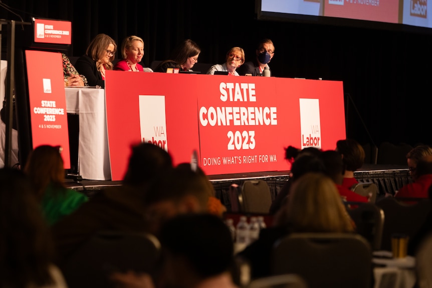 Five people sit behind a table, the front of which reads 'WA Labor State Conference 2023'