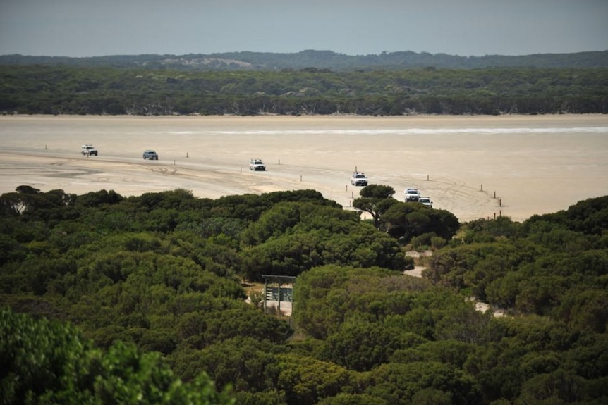 Cars on sand dunes.