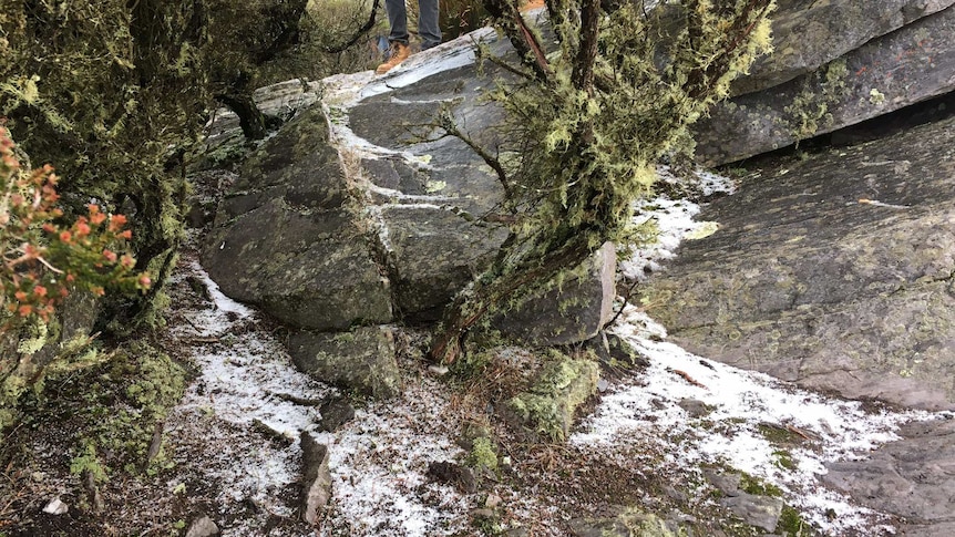 A light dusting of snow on a rocky outcrop.