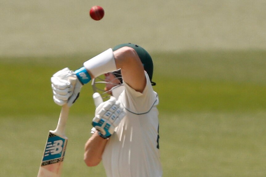 Steve Smith fends a rising ball in front of his face