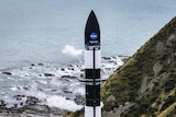 Rocket Lab's Electron rocket can be seen before launch near the coast of Mahia, New Zealand