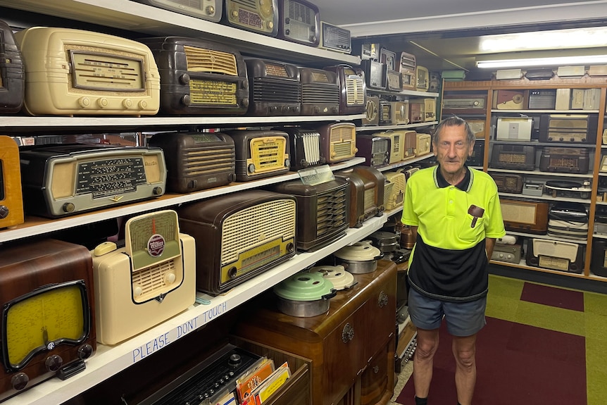 Man stands amongst radio stacked shelves