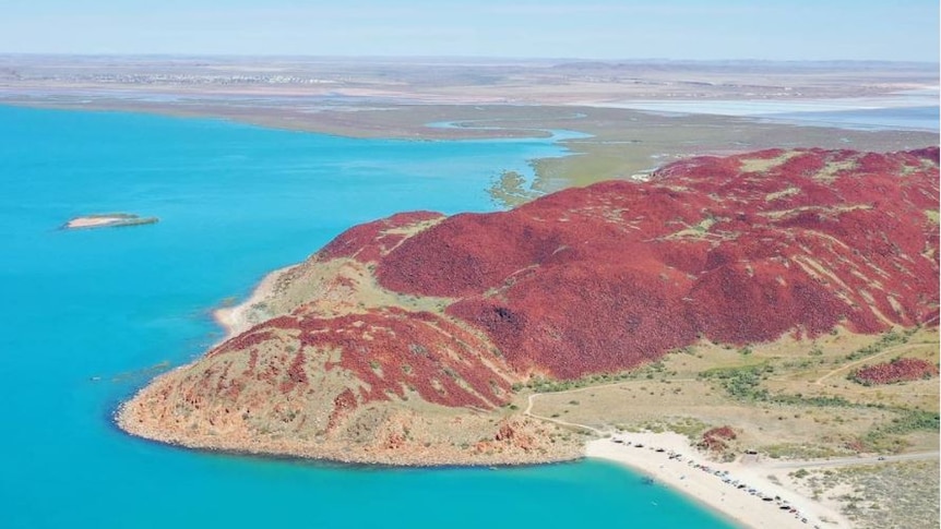 Drone footage of mountains and sea.