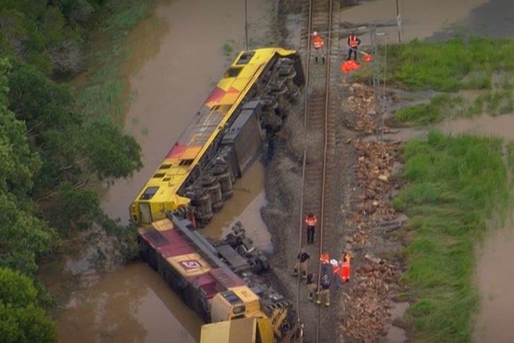 Aerial view of train on its side