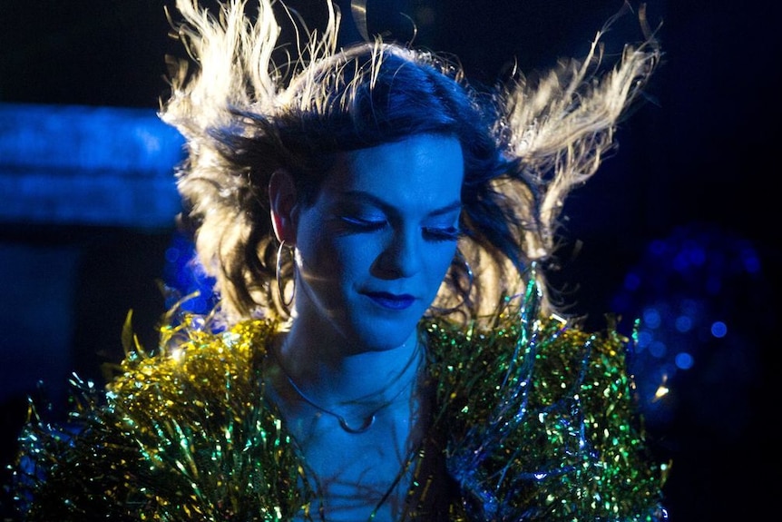 Still image of Daniela Vega from 2018 film A Fantastic Woman with her hair blowing back during a musical number in the film.