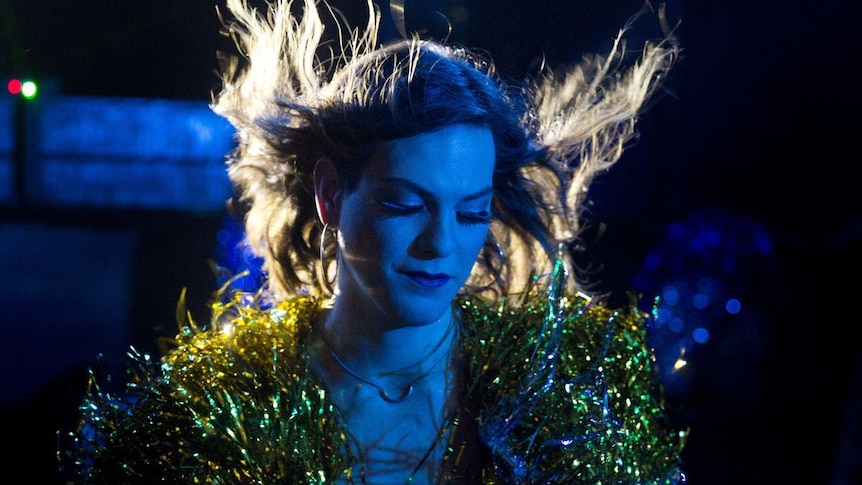 Still image of Daniela Vega from 2018 film A Fantastic Woman with her hair blowing back during a musical number in the film.