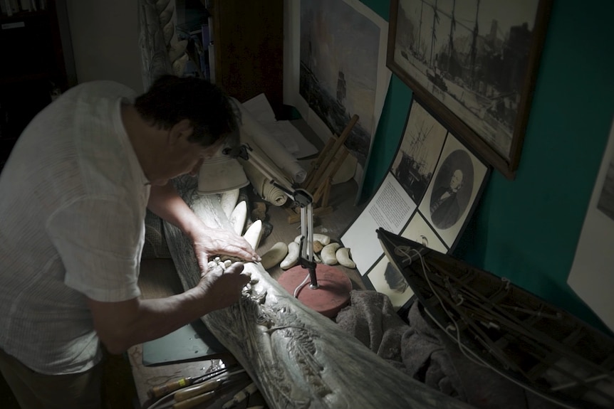 gary tonkin carves whale jaw on his desk