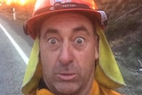 Firefighter's selfie in front of a backburn operation in Tasmania.