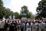 White supremacists gather under a statue of Robert E Lee