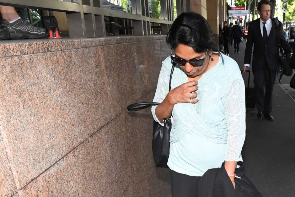 Kumuthini Kannan leaves court. She and her husband have been charged with possessing a slave.