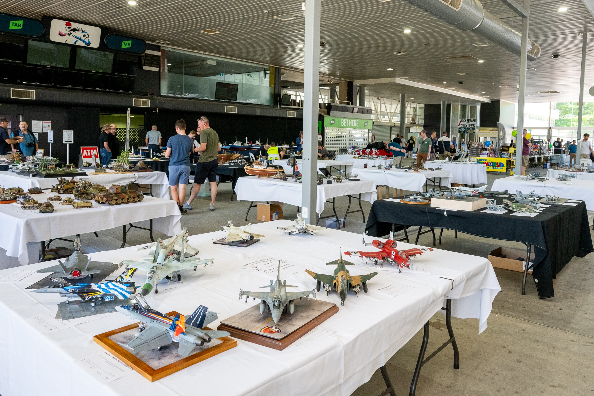 Tables filled with scale models, including planes.