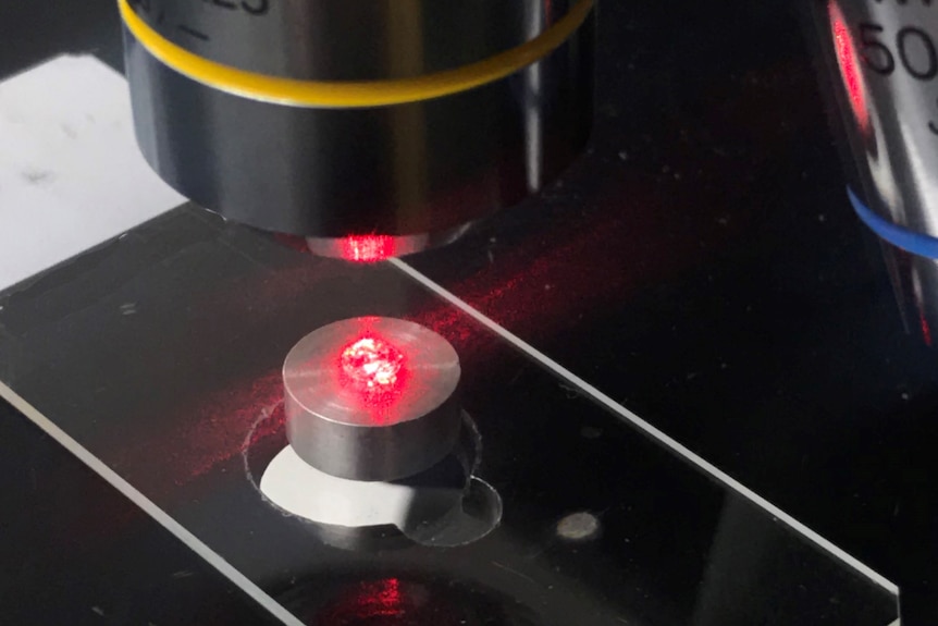 Diamonds under a laser light in a lab.