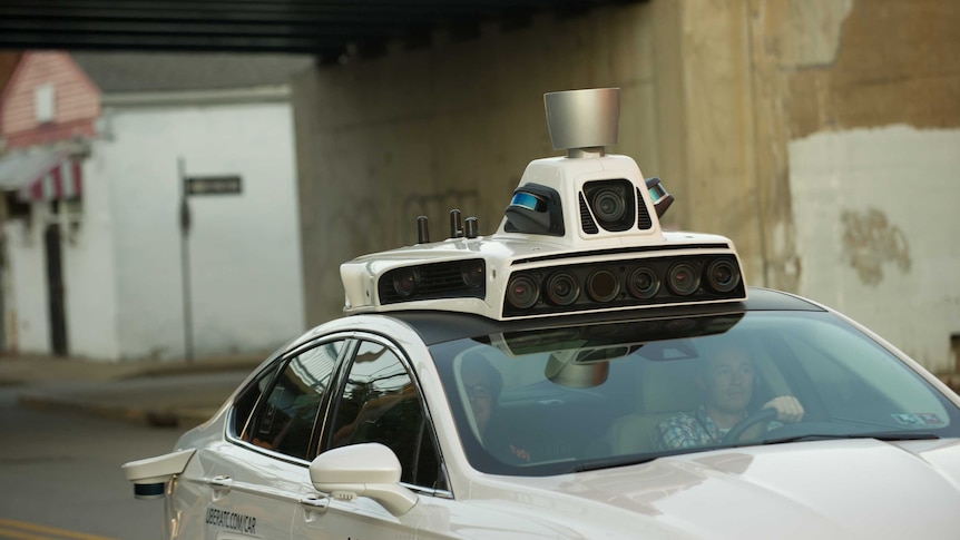 A car with cameras on its roof.