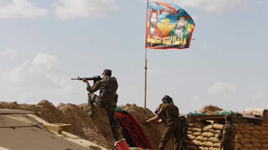 Shiite fighters clash with Islamic State militants north of Baghdad