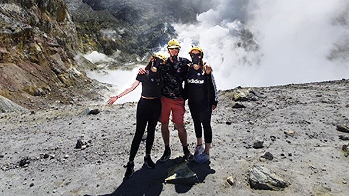 Browitt family stand on the crater rim of White Island Volcano before it exploded