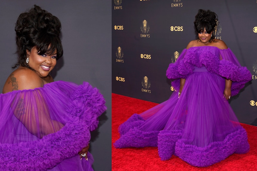Nicole Byer on the red carpet in a floofy purple number