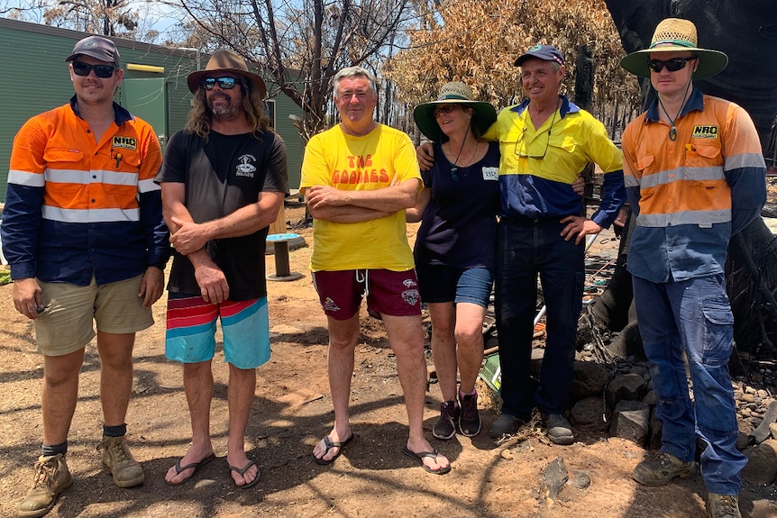 Mark and Jenny Taylor surrounded by four friends and helpers