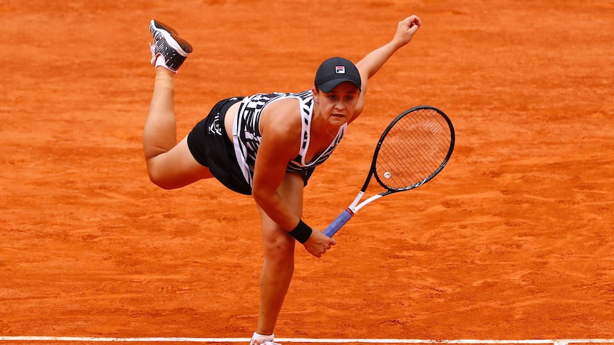 Ash Barty following through on her service motion.