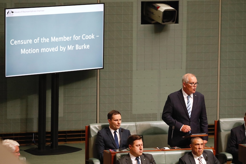Scott Morrison speaks in the House of Representatives in front of sign that reads "censure of the Member for Cook"