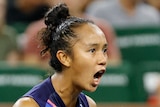 A Canadian professional tennis players pumps her right fist at the Indian Wells tournament.