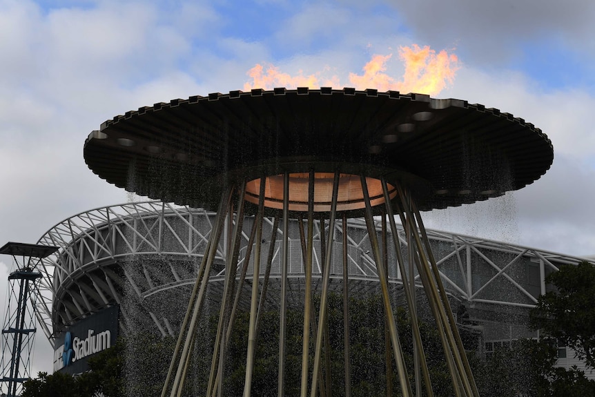 The Sydney Olympic cauldron from the 2000 Games with the flame lit outside the Homebush stadium in 2020.