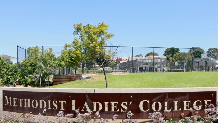 A large limestone sign at Methodist Ladies' College in Claremont with the schools name on it.